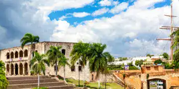 View of Alcazar de Colon Diego Columbus Residence from Spanish Square with blue sky. Famous colonial landmark in Dominican Republic.
