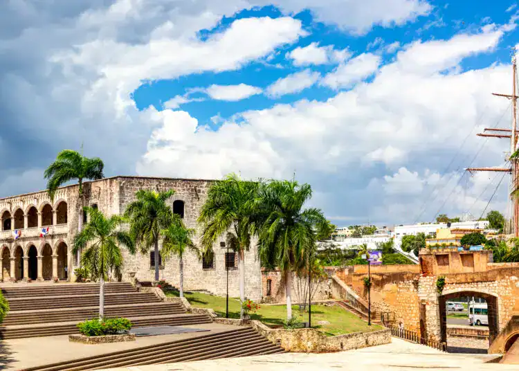 View of Alcazar de Colon Diego Columbus Residence from Spanish Square with blue sky. Famous colonial landmark in Dominican Republic.