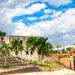 View of Alcazar de Colon Diego Columbus Residence from Spanish Square with blue sky. Famous colonial landmark in Dominican Republic.