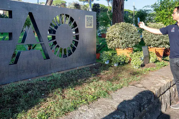 14 October 2022, Rome, Italy - ESA astronaut and FAO GWA Thomas Pesquet cheking the QR code on the new Selfie point. Inauguration of the FAO Selfie Point. World Food Day. FAO Headquarters.Photo credit must be given: &copy;FAO/Giulio Napolitano. Editorial use only. Copyright &copy;FAO.