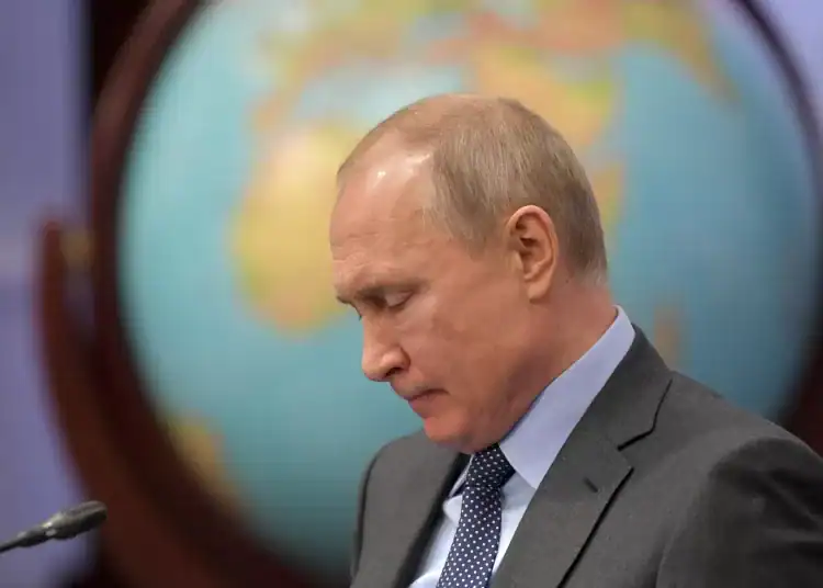 Russian President Vladimir Putin attends a meeting of guardian council of the Russian Geographic Society in St. Petersburg, Russia, Tuesday, April 23, 2019. Putin said the government will pursue an ambitious navy modernization effort. (Alexei Druzhinin, Sputnik, Kremlin Pool Photo via AP) ORG XMIT: XAZ130