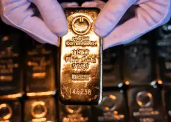 An attendant holds a one kilogram gold bar at Conclude Zrt bullion dealer arranged in Budapest, Hungary, on Monday, Feb. 17, 2025. Gold advanced, following its biggest one-day decline in two months, on nervousness over President Donald Trump's latest trade threats. Photographer: Akos Stiller/Bloomberg via Getty Images