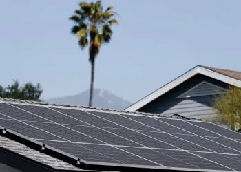 PASADENA, CALIFORNIA - FEBRUARY 25: A view of solar panels atop the roof of a home on February 25, 2025 in Pasadena, California. California officials are considering cutting household rooftop solar energy credits contending that solar customers don’t contribute a fair share to maintenance costs of the power grid. (Photo by Mario Tama/Getty Images)