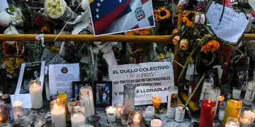 Candles are pictured while friends and relatives pay tribute to the victims in front of the Jet Set nightclub in Santo Domingo on April 12, 2025. The number of deaths caused by the collapse of a discotheque in the Dominican Republic rose to 226, authorities reported on Saturday, as they completed the delivery of the bodies in the early hours of the morning. (Photo by Eddy Vittini / AFP) (Photo by EDDY VITTINI/AFP via Getty Images)
