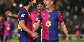 BARCELONA, SPAIN - APRIL 22: Dani Olmo of FC Barcelona celebrates with team mates after scoring the team's first goal during the La Liga EA Sports match between FC Barcelona and RCD Mallorca at Estadi Olimpic Lluis Companys on April 22, 2025 in Barcelona, Spain. (Photo by Alex Caparros/Getty Images)