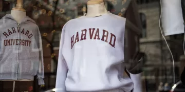 (FILES) Harvard sweatshirts are displayed for sale in a school store window on the Harvard University campus in Cambridge, Massachusetts, on April 15, 2025. US President Donald Trump's administration on Thursday revoked Harvard's right to enroll foreign students -- more than a quarter of its annual enrollment -- in a major escalation of the president's fight with one of the world's most storied universities. Trump is furious at Harvard -- which has produced 162 Nobel prize winners -- for rejecting his demand that it submit to oversight on admissions and hiring over his claims that it is a hotbed of anti-Semitism and "woke" liberal ideology. (Photo by Joseph Prezioso / AFP)