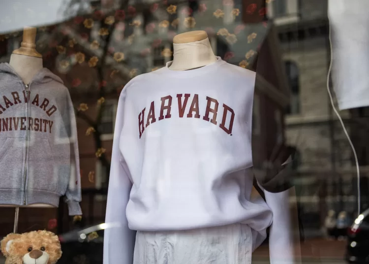 (FILES) Harvard sweatshirts are displayed for sale in a school store window on the Harvard University campus in Cambridge, Massachusetts, on April 15, 2025. US President Donald Trump's administration on Thursday revoked Harvard's right to enroll foreign students -- more than a quarter of its annual enrollment -- in a major escalation of the president's fight with one of the world's most storied universities. Trump is furious at Harvard -- which has produced 162 Nobel prize winners -- for rejecting his demand that it submit to oversight on admissions and hiring over his claims that it is a hotbed of anti-Semitism and "woke" liberal ideology. (Photo by Joseph Prezioso / AFP)