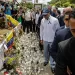New York Mayor Eric Adams (C) walks in front of the Jet Set night club in Santo Domingo on April 14, 2025. The death toll after the collapse of a discotheque roof in the Dominican Republic rose to 231 with the death of five other injured people who were in hospitals, the government said on April 14, 2025. (Photo by STRINGER / AFP) (Photo by STRINGER/AFP via Getty Images)