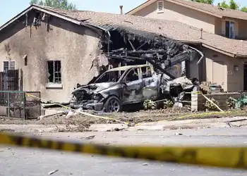SAN DIEGO, UNITED STATES - MAY 22: A view of the damaged area after a small plane crashed into a San Diego neighborhood in the US state of California, killing several people, according to media reports on May 22, 2025.The San Diego Fire-Rescue Department said the private jet crashed into a military housing unit, striking about 15 homes, setting ablaze multiple homes and cars. (Photo by Wai Lee Michael Ho/Anadolu via Getty Images)