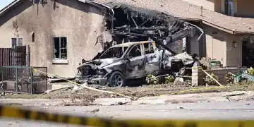 SAN DIEGO, UNITED STATES - MAY 22: A view of the damaged area after a small plane crashed into a San Diego neighborhood in the US state of California, killing several people, according to media reports on May 22, 2025.The San Diego Fire-Rescue Department said the private jet crashed into a military housing unit, striking about 15 homes, setting ablaze multiple homes and cars. (Photo by Wai Lee Michael Ho/Anadolu via Getty Images)
