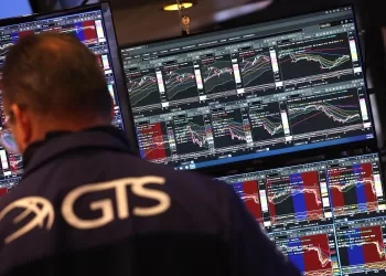 Traders work on the floor of the New York Stock Exchange (NYSE) at the opening bell on May 23, 2025, in New York City. Wall Street stocks opened lower May 23 after the opening bell, the S&P 500 was down 1.2 percent after US President Donald Trump warned of 50 percent tariffs on EU goods and 25 percent tariffs on Apple. (Photo by TIMOTHY A. CLARY / AFP)