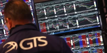 Traders work on the floor of the New York Stock Exchange (NYSE) at the opening bell on May 23, 2025, in New York City. Wall Street stocks opened lower May 23 after the opening bell, the S&P 500 was down 1.2 percent after US President Donald Trump warned of 50 percent tariffs on EU goods and 25 percent tariffs on Apple. (Photo by TIMOTHY A. CLARY / AFP)