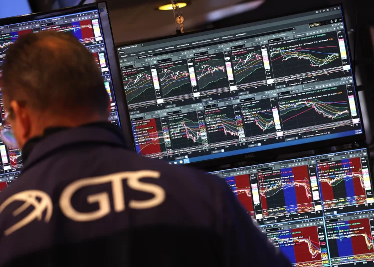 Traders work on the floor of the New York Stock Exchange (NYSE) at the opening bell on May 23, 2025, in New York City. Wall Street stocks opened lower May 23 after the opening bell, the S&P 500 was down 1.2 percent after US President Donald Trump warned of 50 percent tariffs on EU goods and 25 percent tariffs on Apple. (Photo by TIMOTHY A. CLARY / AFP)
