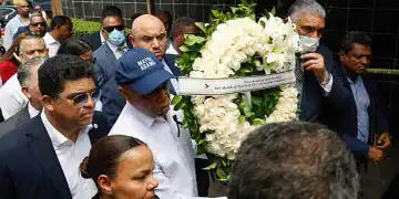 New York Mayor Eric Adams carries a wreath in front of the Jet Set night club in Santo Domingo on April 14, 2025. The death toll after the collapse of a discotheque roof in the Dominican Republic rose to 231 with the death of five other injured people who were in hospitals, the government said on April 14, 2025. (Photo by STRINGER / AFP) (Photo by STRINGER/AFP via Getty Images)