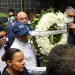 New York Mayor Eric Adams carries a wreath in front of the Jet Set night club in Santo Domingo on April 14, 2025. The death toll after the collapse of a discotheque roof in the Dominican Republic rose to 231 with the death of five other injured people who were in hospitals, the government said on April 14, 2025. (Photo by STRINGER / AFP) (Photo by STRINGER/AFP via Getty Images)