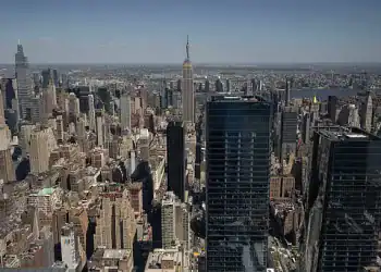 Buildings in the Manhattan skyline in New York, US, on Saturday, May 10, 2025. New York City officials cut their forecast for the number of international tourists this year by 17%, saying President Donald Trumps tariffs and hard-line policies on immigration are deterring visitors. Photographer: Yuki Iwamura/Bloomberg via Getty Images