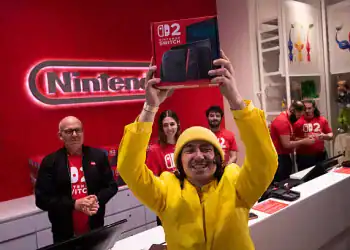 A customer reacts with his Nintendo Switch 2 game console at a Nintendo Co. store in New York, US, early on Thursday, June 5, 2025. Nintendo fans stood in line for hours to be among the first to get ahold of the Switch 2 and take part in one of the biggest gadget debuts in years. Photographer: Adam Gray/Bloomberg via Getty Images