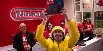 A customer reacts with his Nintendo Switch 2 game console at a Nintendo Co. store in New York, US, early on Thursday, June 5, 2025. Nintendo fans stood in line for hours to be among the first to get ahold of the Switch 2 and take part in one of the biggest gadget debuts in years. Photographer: Adam Gray/Bloomberg via Getty Images