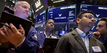 Traders work on the floor of the New York Stock Exchange (NYSE) during the Voyager Technologies Inc. initial public offering (IPO) in New York, US, on Wednesday, June 11, 2025. Voyager Technologies Inc. shares are indicated to open at $65 to $66 each on Wednesday, as much as 112% above the initial public offering price of $31 each. Photographer: Michael Nagle/Bloomberg via Getty Images