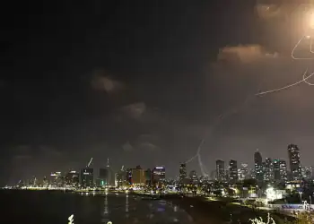 TEL AVIV, ISRAEL - JUNE 13: Smoke rises from residential areas after Iranian army launches a retaliatory attack, reportedly firing hundreds of ballistic missiles to Israel following Israel's attacks on various cities in Iran, on June 13, 2025 in Tel Aviv, Israel. (Photo by Saeed Qaq/Anadolu via Getty Images)