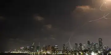 TEL AVIV, ISRAEL - JUNE 13: Smoke rises from residential areas after Iranian army launches a retaliatory attack, reportedly firing hundreds of ballistic missiles to Israel following Israel's attacks on various cities in Iran, on June 13, 2025 in Tel Aviv, Israel. (Photo by Saeed Qaq/Anadolu via Getty Images)