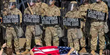 LOS ANGELES, CALIFORNIA - JUNE 09: Protesters confront California National Guard soldiers and police outside of a federal building as protests continue in Los Angeles following three days of clashes with police after a series of immigration raids on June 09, 2025 in Los Angeles, California. Tensions in the city remain high after the Trump administration called in the National Guard against the wishes of city leaders.  (Photo by David McNew/Getty Images)