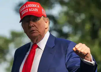 WASHINGTON, DC - JUNE 21: President Donald Trump raises his fist as he returns to the White House prior to a meeting with his National Security Council to discuss the ongoing conflict between Iran and Israel on June 21, 2025 in Washington, DC. (Photo by Craig Hudson For The Washington Post via Getty Images)