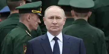 MOSCOW, RUSSIA - JUNE 22:  (RUSSIA OUT) Russian President Vladimir Putin, surrounded by armed forces's officers, attends a wreath laying ceremony to the Unknown Soldier's Tomb in the Alexander Garden along the Kremlin wall on June 22, 2025 in Moscow, Russia. The day commemorates Operation Barbarossa, in which the Axis powers invaded the Soviet Union during World War II. (Photo by Contributor/Getty Images)