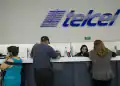 Employees assist customers at an America Movil SAB Telcel service center in Mexico City, Mexico, on Tuesday, July 21, 2015. North America's wireless carriers are in a race to attract customers who make frequent calls and trips between the U.S. and Mexico. America Movil SAB, AT&T Inc., T-Mobile US Inc. and Telefonica Mexico have all introduced plans this year that end cross-border roaming charges and take advantage of a two-country region with more than 400 million people.P hotographer: Susana Gonzalez/Bloomberg via Getty Images