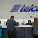 Employees assist customers at an America Movil SAB Telcel service center in Mexico City, Mexico, on Tuesday, July 21, 2015. North America's wireless carriers are in a race to attract customers who make frequent calls and trips between the U.S. and Mexico. America Movil SAB, AT&T Inc., T-Mobile US Inc. and Telefonica Mexico have all introduced plans this year that end cross-border roaming charges and take advantage of a two-country region with more than 400 million people.P hotographer: Susana Gonzalez/Bloomberg via Getty Images