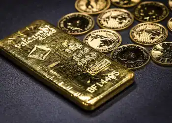 One-ounce Britannia gold coins and a one kilogram gold bar at The Vaults Group gold dealers arranged in Barcelona, Spain, on Monday, April 28, 2025. Gold was steady after dropping Tuesday as President Donald Trump eased the impact of some auto tariffs and pointed to progress in trade negotiations with several countries. Photographer: Angel Garcia/Bloomberg via Getty Images