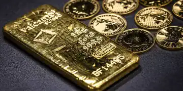 One-ounce Britannia gold coins and a one kilogram gold bar at The Vaults Group gold dealers arranged in Barcelona, Spain, on Monday, April 28, 2025. Gold was steady after dropping Tuesday as President Donald Trump eased the impact of some auto tariffs and pointed to progress in trade negotiations with several countries. Photographer: Angel Garcia/Bloomberg via Getty Images
