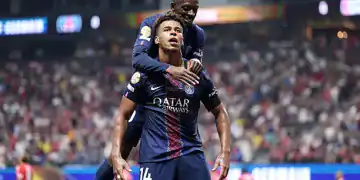 ATLANTA, GEORGIA - JULY 05: Desire Doue #14 of Paris Saint-Germain celebrates scoring his team's first goal with teammate Ousmane Dembele #10 during the FIFA Club World Cup 2025 quarter-final match between Paris Saint-Germain and FC Bayern München at Mercedes-Benz Stadium on July 05, 2025 in Atlanta, Georgia. (Photo by Steph Chambers - FIFA/FIFA via Getty Images)