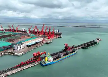 A cargo ship unloads thermal coal at the coal terminal of Lianyungang Port in Lianyungang City, Jiangsu Province, China, on July 28, 2025. (Photo by Costfoto/NurPhoto via Getty Images)