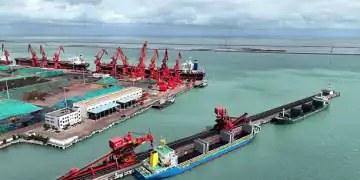 A cargo ship unloads thermal coal at the coal terminal of Lianyungang Port in Lianyungang City, Jiangsu Province, China, on July 28, 2025. (Photo by Costfoto/NurPhoto via Getty Images)