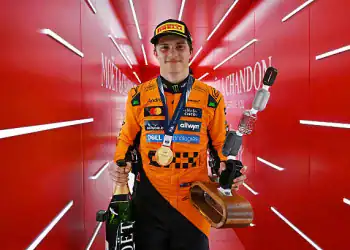 SPA, BELGIUM - JULY 27: Race winner Oscar Piastri of Australia and McLaren leaves the podium with his trophy and Champagne during the F1 Grand Prix of Belgium at Circuit de Spa-Francorchamps on July 27, 2025 in Spa, Belgium. (Photo by Mark Sutton - Formula 1/Formula 1 via Getty Images)