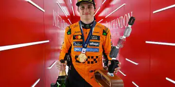 SPA, BELGIUM - JULY 27: Race winner Oscar Piastri of Australia and McLaren leaves the podium with his trophy and Champagne during the F1 Grand Prix of Belgium at Circuit de Spa-Francorchamps on July 27, 2025 in Spa, Belgium. (Photo by Mark Sutton - Formula 1/Formula 1 via Getty Images)