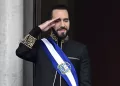 (FILES) El Salvador's President Nayib Bukele salutes during the military parade after being sworn in at the National Palace in downtown San Salvador on June 1, 2024. El Salvador's ruling-party-dominated Congress is discussing indefinite presidential reelection on July 31, 2025, aiming towards President Nayib Bukele's continued presidency. This reform also proposes extending the term of office from five to six years. (Photo by Marvin Recinos / AFP)
