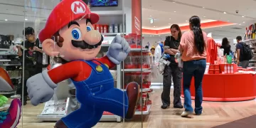 Customers visit a Nintendo store in central Tokyo on August 1, 2025. Nintendo on August 1, reported a 132 percent year-on-year surge in quarterly revenue thanks to the Switch 2, which became the world's fastest-selling console after its launch in June. (Photo by Richard A. Brooks / AFP)