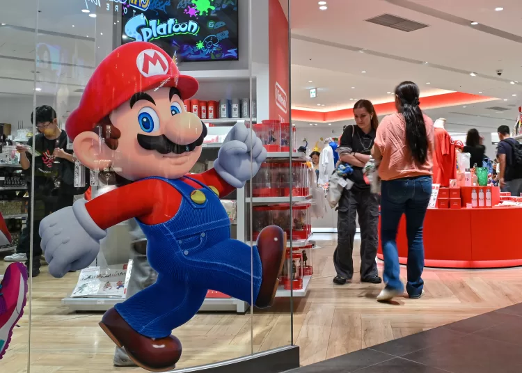 Customers visit a Nintendo store in central Tokyo on August 1, 2025. Nintendo on August 1, reported a 132 percent year-on-year surge in quarterly revenue thanks to the Switch 2, which became the world's fastest-selling console after its launch in June. (Photo by Richard A. Brooks / AFP)