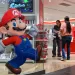 Customers visit a Nintendo store in central Tokyo on August 1, 2025. Nintendo on August 1, reported a 132 percent year-on-year surge in quarterly revenue thanks to the Switch 2, which became the world's fastest-selling console after its launch in June. (Photo by Richard A. Brooks / AFP)