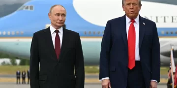 US President Donald Trump (R) and Russian President Vladimir Putin pose on a podium on the tarmac after arrival at Joint Base Elmendorf-Richardson in Anchorage, Alaska, on August 15, 2025. Putin is in Alaska at the invitation of Trump in his first visit to a Western country since he ordered the 2022 invasion of Ukraine that has killed tens of thousands of people. (Photo by ANDREW CABALLERO-REYNOLDS / AFP)