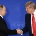 US President Donald Trump (R) and Russian President Vladimir Putin shake hands at the end of a joint press conference after participating in a US-Russia summit on Ukraine at Joint Base Elmendorf-Richardson in Anchorage, Alaska, on August 15, 2025. (Photo by Drew ANGERER / AFP)