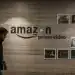An employee walks past a wall display for Amazon.com Inc.'s Prime Video streaming service at the company's office campus in Hyderabad, India, on Friday, Sept. 6, 2019. Amazon's only company-owned campus outside the U.S. opened at the end of August on the other side of the globe, thousands of miles from their Seattle headquarters. The 15-storey building towers over the landscape in Hyderabad's technology and financial district, signaling the giant online retailer's ambitions to expand in one of the world's fastest-growing retail markets. Photographer: Dhiraj Singh/Bloomberg via Getty Images