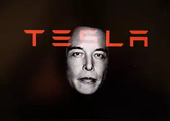 Double exposure photograph of a portrait of Elon Musk and the name of his company Tesla at Kerlouan in Brittany in France on May 21 2025. (Photo by Vincent Feuray / Hans Lucas / Hans Lucas via AFP) (Photo by VINCENT FEURAY/Hans Lucas/AFP via Getty Images)