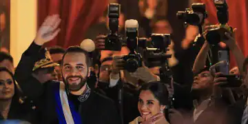 SAN SALVADOR, EL SALVADOR - JUNE 1: President Nayib Bukele of El Salvador and his wife, Gabriela Bukele, greet supporters after a message to the citizens for the 6 years of Bukele's government at the National Theatre in the Historic Center on June 1, 2025 in San Salvador, El Salvador. (Photo by Alex Peña/Getty Images)