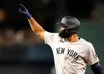 ARLINGTON, TX - AUGUST 4: Amed Rosario #14 of the New York Yankees celebrates after hitting a single against the Texas Rangers during the second inning at Globe Life Field on August 4, 2025 in Arlington, Texas. (Photo by Ron Jenkins/Getty Images)