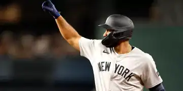 ARLINGTON, TX - AUGUST 4: Amed Rosario #14 of the New York Yankees celebrates after hitting a single against the Texas Rangers during the second inning at Globe Life Field on August 4, 2025 in Arlington, Texas. (Photo by Ron Jenkins/Getty Images)