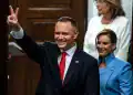 Karol Nawrocki, Poland's president, center, and his wife Marta Nawrocka, following his inauguration ceremony at the National Assembly in Warsaw, Poland, on Wednesday, Aug. 6, 2025. Nawrocki, the nationalist outsider who scored a shock victory in June's runoff for president, was inaugurated on Wednesday, setting up a battle with Tusk's pro-EU administration. Photographer: Damian Lemanski/Bloomberg via Getty Images