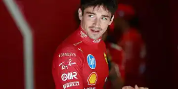 BUDAPEST, HUNGARY - AUGUST 02: Charles Leclerc of Monaco and Scuderia Ferrari greets a teammate in the garage during final practice ahead of the F1 Grand Prix of Hungary at Hungaroring on August 02, 2025 in Budapest, Hungary. (Photo by Mark Thompson/Getty Images)